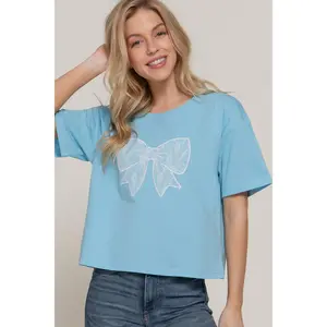 Oversized cotton top with round neck, short sleeves, and lace trim.
