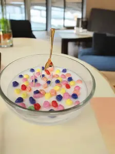 Glass bowl of fruity smelling fruity cereal candle