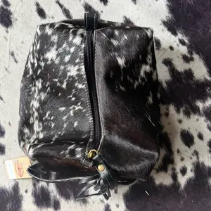 Black and white cowhide toiletry bag