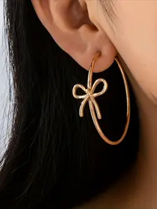 A Pair of Bold, Oversized Hoop Earrings Featuring Geometric Bows—perfect for Banquets and Vacation Getaways.