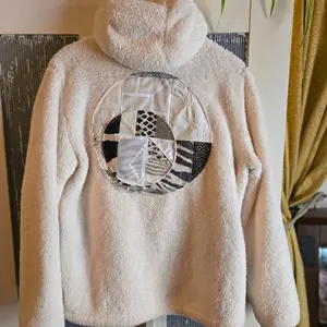 Up-cycled fleece hoodie with quilted accents