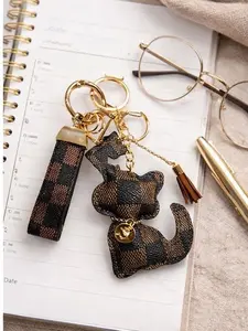 Chic Checkered Cat Keychain Bag Charm with Tassel and Gold Accent for Stylish Accessories Chic Checkered Cat Keychain Bag Charm with Tassel and Gold Accent for Stylish Accessories