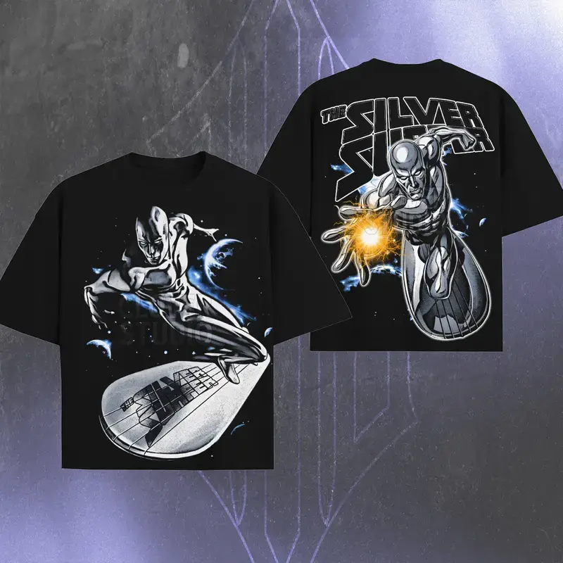 Vintage The Silver Surfer Double Sided Black T Shirt Front Silver Surfer Surfboard Space Flying Character Graphic Back Energy Orb Pose THE SILVER SURFER Bold Letter Print Oversized Unisex Cosmic Hero Short Sleeve Streetwear Tee
