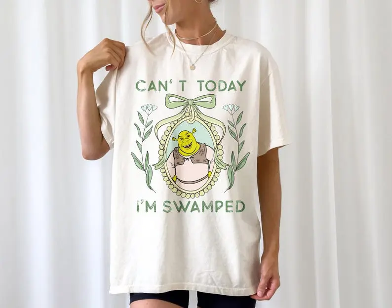 Women's Casual Cotton T-Shirt with a Coquette Style and Funny "Can't Today I'm Swamped" Shrek Meme Graphic, Fun Meme Message, Round Neck