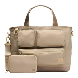 Lululemon Multi-Pocket Tote Bag with Classic Logo in Nylon for Men and Women, 19.5L Capacity in Warm Gray, Light Oak, and Crater Blue