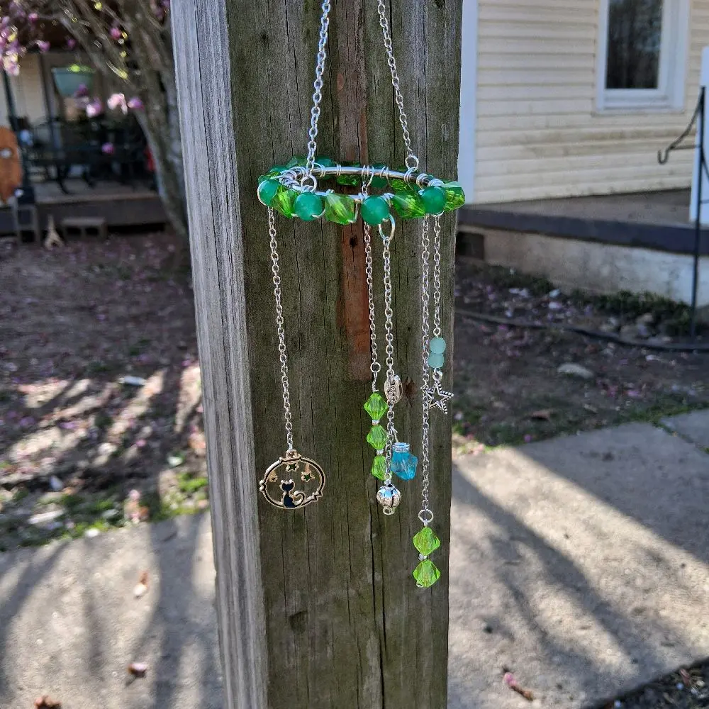 Suncatcher with Multiple Colored Green Beads and Several Hanging Charms for Outdoor Decor