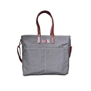 A stylish, durable tote for everyday use and travel. Features a water-resistant exterior + interior, padded laptop compartment (fits up to 17”), multiple pockets, trolley sleeve, and removable shoulder strap for ultimate organization on the go.