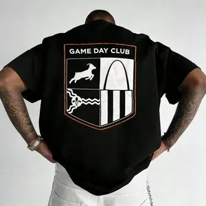 "Game Day Club" St. Louis-inspired shield-patterned loose-fitting T-shirt, made of soft, breathable, and comfortable pure cotton, a retro football game day streetwear style top, the ideal gift for game day fashion enthusiasts and sports aesthetics fans.