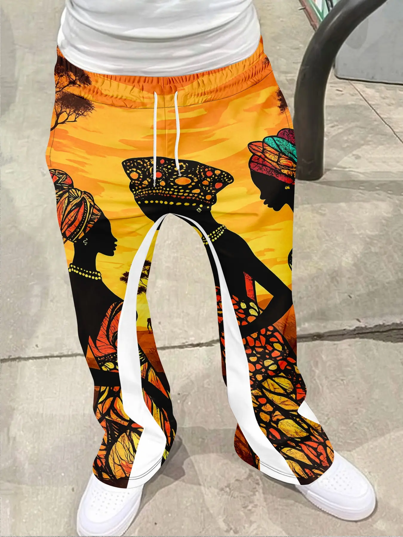 Men's streetwear retro Fitted flared pants, Bohemian street trousers, with black art illustration style, drawstring waistband, white stripes on the sides, tassel decoration on the hem