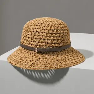 Handcrafted grass hat. Women’s hollow crocheted bucket-shaped sun hat with faux leather trim. Wide brim design provides UV protection. Fisherman’s hat style, lightweight and breathable, suitable for summer beach use and everyday wear.