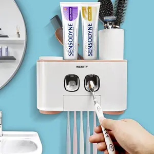 Toothbrush Holder Wall Mounted, WEKITY Multi-Functional Toothbrush and Toothpaste Dispenser for Bathroom, with 5 Toothbrush Slots, 2 Toothpaste Squeezers and 4 Cups(Pink) Set