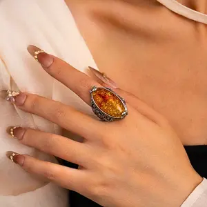 Baltic amber oval ring with classic hollow flower pattern, elegant, suitable for women to wear daily, as a gift