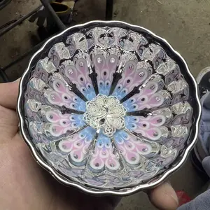 Built by the owner, the luminous silver peacock cup is handmade