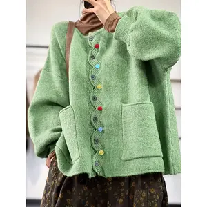 Women’s knitted cardigan with colorful buttons, loose fit bubble sleeve jacket, pocketed casual top, fashionable outerwear, knitwear