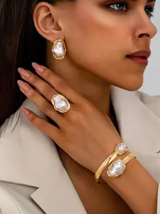 Three-piece vintage faux pearl ring and earring set, stylish jewelry design, perfect for summer fashion.