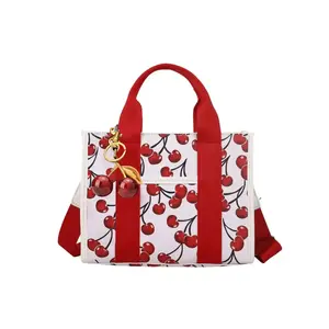Personalized and trendy exquisite women's crossbody bag shoulder bag, casual trendy bag, simple and niche, cherry patterned women's bag with design sense, with cherry pendant, suitable for daily occasions such as commuting, shopping, parties, dates, etc.