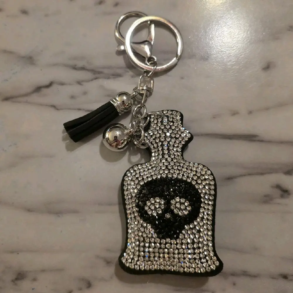 Rhinestone Skull Keychain with Tassel and Bell - Black and Silver Design