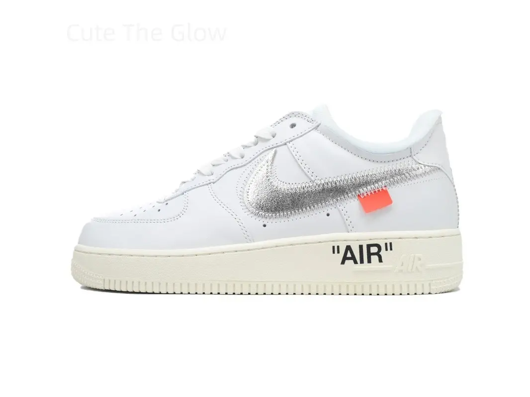 Clean cream white smooth leather low top skate sneakers, reflective silver raw stitch side logo with bright orange square tag, vintage off-white shock-absorbing rubber sole, unisex trainers matching hip-hop, street rap and urban skate outfits