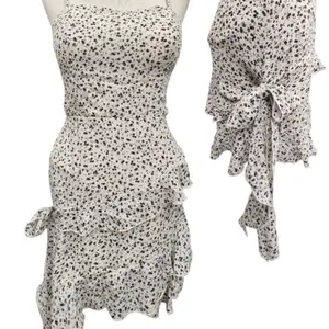 Playful Summer Dress with Spotted Pattern and Ruffled Details - As shown in the Image