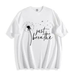 Casual Minimalist Unisex T-Shirt Dandelion And Just Breathe Text Design Perfect For Everyday Wear Spring And Summer Seasons Ideal Gift For Friends Family Or Yourself