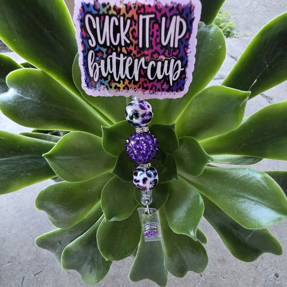 Suck It Up Buttercup Badge Reel with Purple Leopard Print Beads and Colorful Leopard Print Design