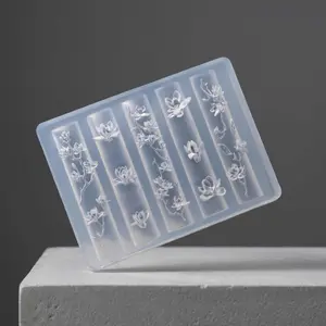 Nail art silicone molds with 3D embossed floral designs, paired with nail polish gel for high-transparency decorative accessories, crystal nail grinding tools DIY carving gel molds