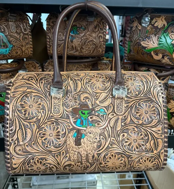 Genuine hand tooled & painted speedy bag- Alien riding highland cow Genuine hand tooled & painted speedy bag- Alien riding highland cow