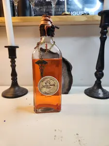 Thicket Hill Games, Potion of Superior Potion Bottle, Perfect as a decoration or to enhance your TTRPG Game, liquid is made from colored water and mica powder, features a snake and staff charm and wax seal. Halloween