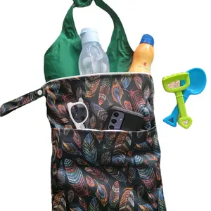 Wet Bag + On- The -go + Multi use + Bonus changing pad + Beach + Gym + Attaches to anything + Waterproof + Smell proof