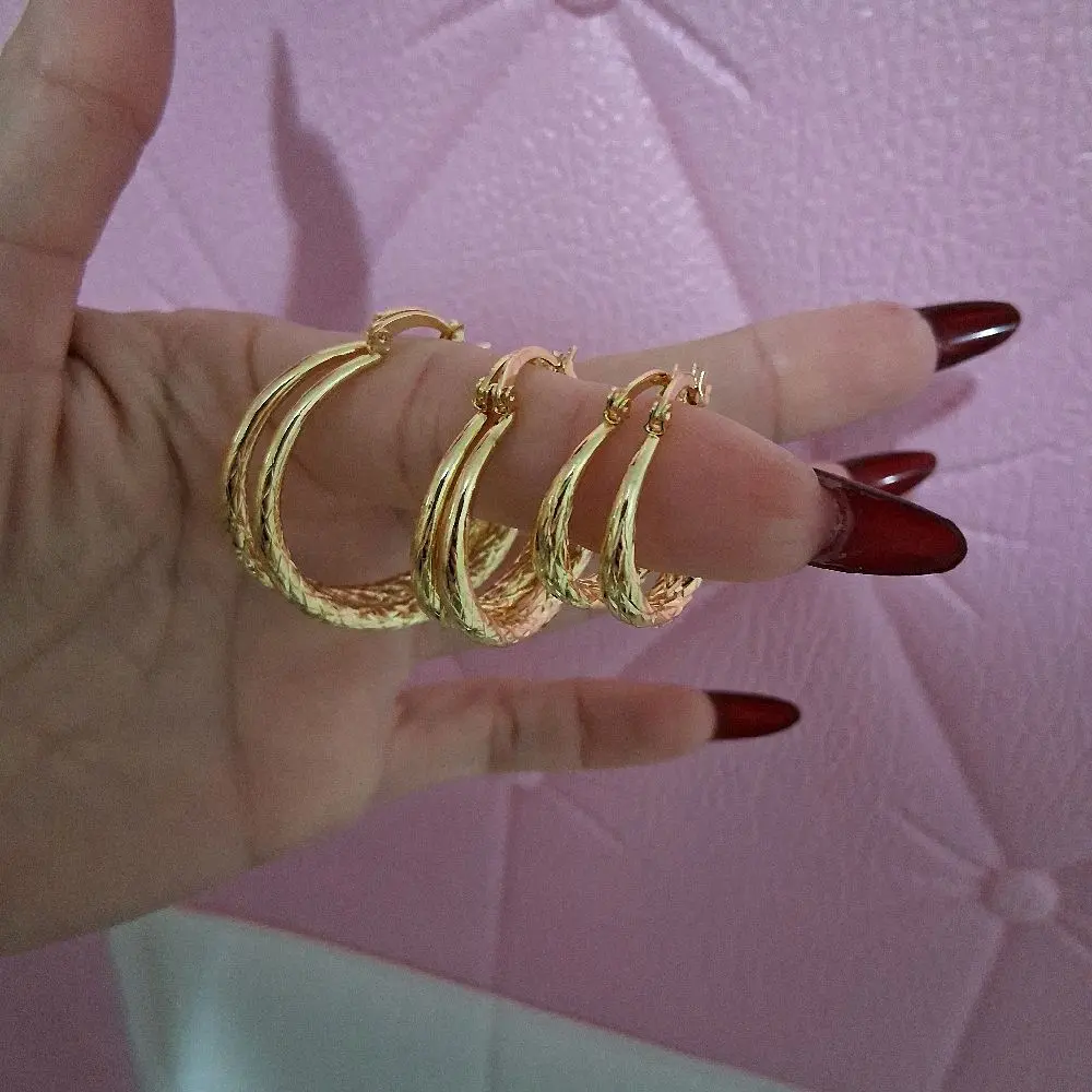 Set  of 3 pairs of 14 k gold laminated Hoop Earrings.
