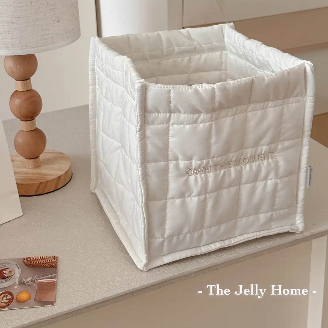 Large solid-color stitched desk storage basket, square fabric book organizer box with embroidered details, soft padded foldable storage container for textbooks, stationery, and documents—ideal for office desktop organization.