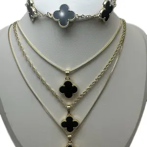 Stunning black onyx jewelry set!  Featuring a layered necklace, bracelet, and earrings with elegant gold accents. Perfect for adding a touch of luxury to any look!