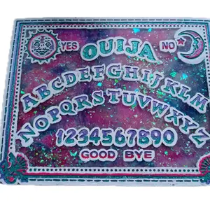 Resin Ouija Board with planchette also know as a spirit board used for many years to contact spirits or the dead. Travel size game board for easy travel fun