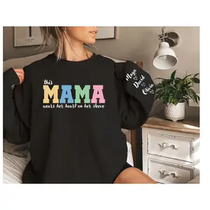 Custom This Mama Wears Her Heart On Her Sleeve Sweatshirt, Personalized Mom With Kids Names Tee, Motherhood Hoodie, Mother's Day Gifts