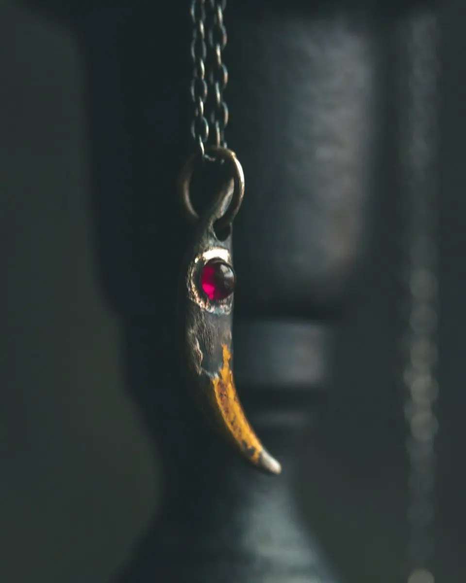 Fox Fang Pendant with Rare Neon Rhodolite Garnet: A Talisman of Passion, Transformation, and Hidden Power