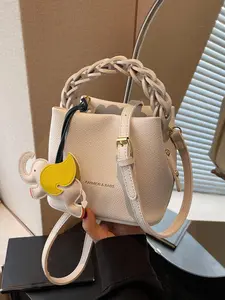 Minimalist versatile design bucket bag shoulder crossbody, versatile literary white handbag, with exquisite elephant pendant, zipper design multi-color women's handbag crossbody bag students and office workers must have