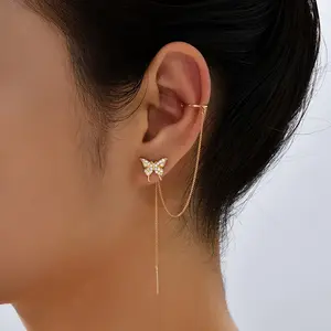 Elegant Golden-Tone Butterfly Ear Cuff With Sparkling Zirconia Stones And Tassel Accents - Chic C-Shaped Ear Clip For Women, Ideal For Weddings And Daily Wear. Cute Jewelry