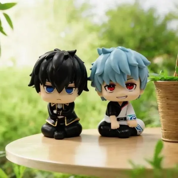 Chibi-style figures of Sakata Gintoki and Hijikata Toshiro (seated poses) – Anime-themed collectible models/toys.