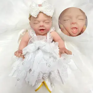 10 Inch Adorable Closed Eyes Full Body Solid Silicone Girl Doll With Beautiful Outfis And Painted Bald 3D Painted Skin Handmade Flexible Soft Touch Feeling Newborn Girl Doll For Children's Toy Doll
