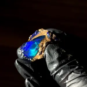 7.5 gram Dark blue Ethiopian specimen opal with pebble matrix green and purple flashes