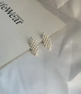 E15-The 'Aria' Sculptural Pearl Cascade Earrings – A Luminous Cluster for the Modern Silhouette. #pearlearrings #statementearrings #bridalearrings #weddingjewelry #freshwaterpearls #elegantjewelry #oldmoneyaesthetic #quietluxury #clusterearrings