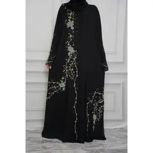 The Amal Abaya is a handcrafted piece with intricate front and back detailing. Gold and silver floral vines flow from the shoulders down, creating an elegant, elongated look. The design continues seamlessly onto the back for a full, cohesive finish.
