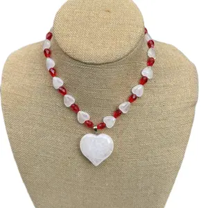 Milky white quartz heart beads with red crystal spacers and a heart toggle clasp