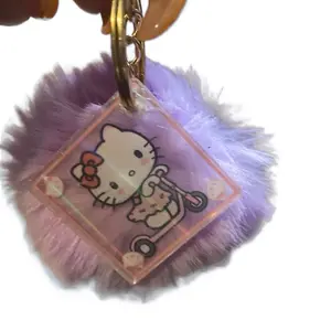 Pom pom with a hello ketty on a key chain
