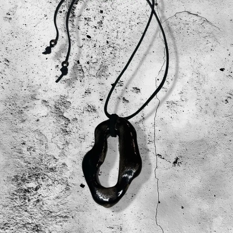 Black Abstract oval shaped ceramic pendant necklace with adjustable cord