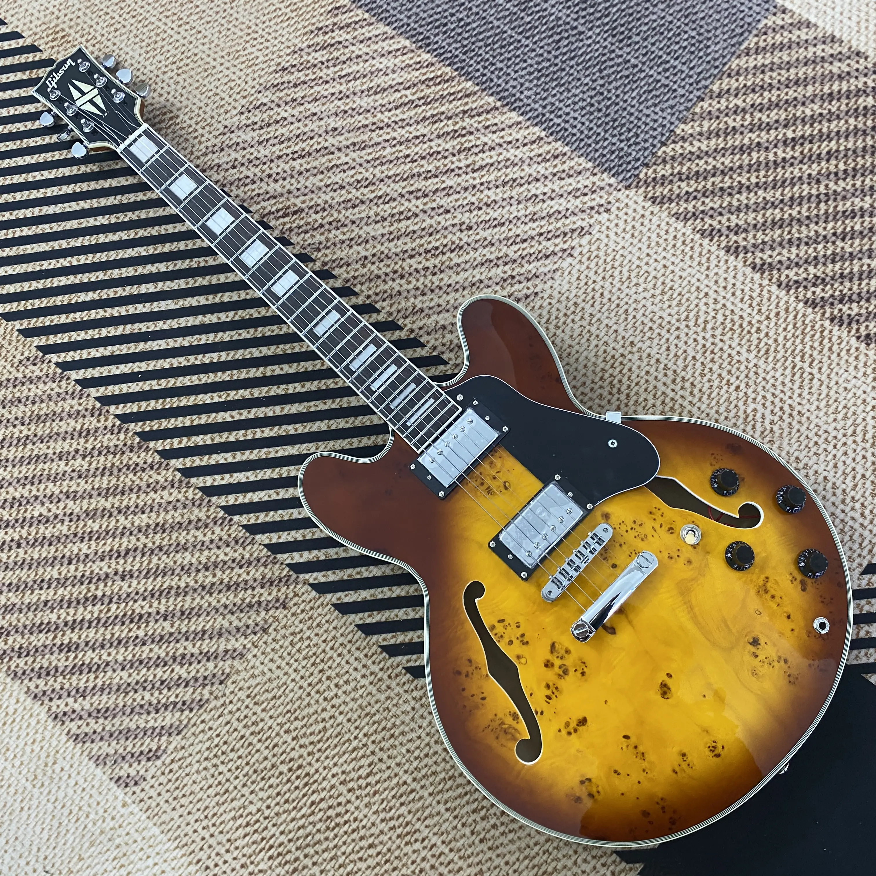 Half hollow sunset-colored F-hole electric guitar, maple body, HH pickups, chrome hardware, 22 strings