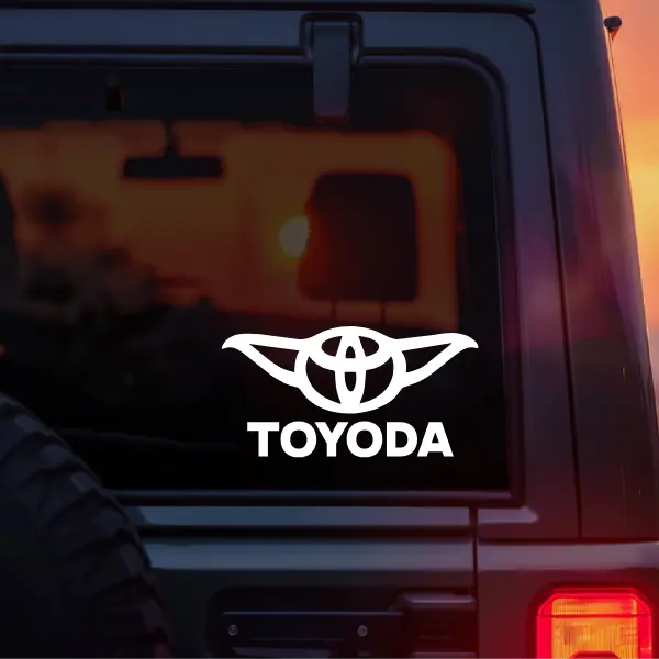 Toyoda Funny Vinyl Car Decal – Cute Space Creature Parody Logo Sticker for Car Window Laptop Tumbler – Funny Sci Fi Inspired Automotive Meme Decal Gift