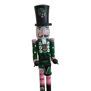 Hand-painted wooden nutcracker. He measures 24 inches tall. “Gunner” is a handsome guy that absolutely can live in your space year round.
