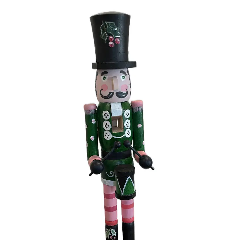 Hand-painted wooden nutcracker. He measures 24 inches tall. “Gunner” is a handsome guy that absolutely can live in your space year round.
