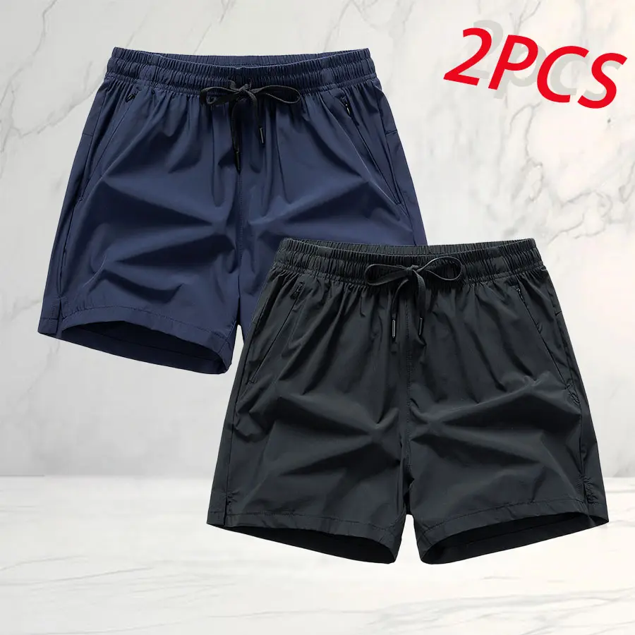 Men’s summer athletic shorts, two-pack, American casual sporty style. Quick-dry, breathable fabric keeps you cool and wicks away sweat. Zippered pockets securely hold a phone, and a drawstring waistband is loose and doesn’t squeeze. A relaxed fit prevents